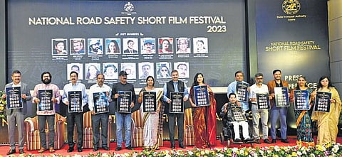 Dignitaries holding the poster of the short film festival | Express