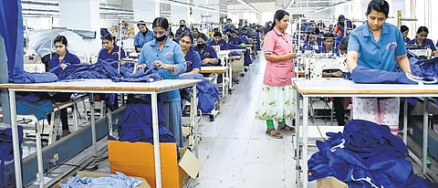 Workers stitching the uniform of Israel police at Marian Apparels in Kannur