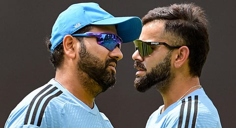 India's captain Rohit Sharma (L) talks with teammate Virat Kohli during a practice session. (Photo | AFP)