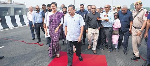 CM Arvind Kejriwal with PWD minister Atishi at the new flyover | pti