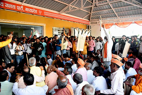 BJP workers from Kalapeepal state assembly constituency protest against the ticket distribution ahead of the assembly elections, at the party headquarters, in Bhopal on Oct. 22, 2023. (Photo | PTI)