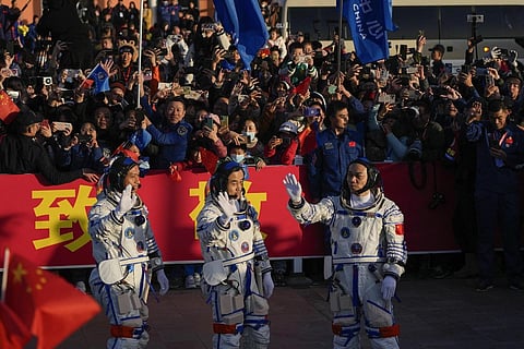 Chinese astronauts for the Shenzhou-17 mission wave during a send-off ceremony at Jiuquan Satellite Launch Center, Thursday, Oct 26, 2023. (Photo | AP)