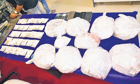 Krishna district police displayed the recovered gold, which was stolen from Manappuram Financing Limited, in Machilipatnam on Friday I Express