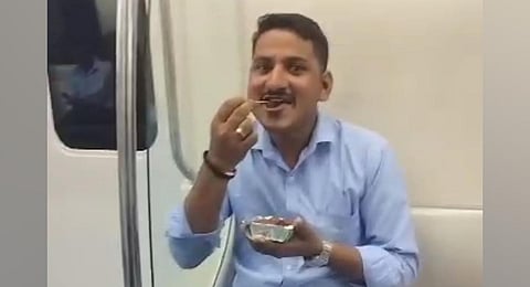 A viral video of Sunil Kumar eating in a Metro train in Bengaluru. (Photo | Instagram)