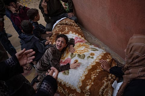 Palestinians mourn their relatives killed in the Israeli bombardment of the Gaza Strip, in the hospital in Khan Younis, Saturday, Nov. 11, 2023. ( AP Photo/Fatima Shbair)