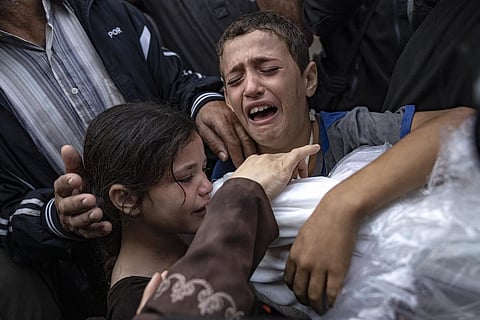 Palestinians mourn their relatives killed in the Israeli bombardment of the Gaza Strip, in the hospital in Khan Younis, Tuesday, Nov. 14, 2023. (Photo | AP)