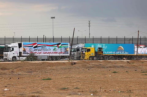 Trucks carrying aid cross into Rafah in the southern Gaza Strip on November 15, 2023 (AFP)