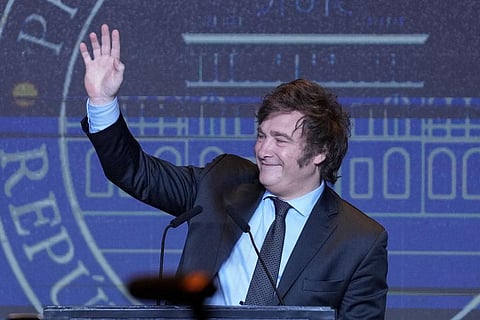 Presidential candidate of the Liberty Advances coalition Javier Milei waves during his victory speech after being elected president in a runoff election in Buenos Aires, Nov. 19, 2023. (Photo | AP)