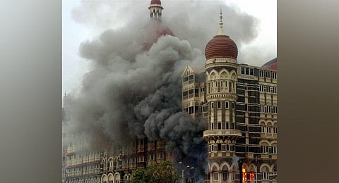 FILE - Smoke is seen billowing out of the Taj Hotel in south Mumbai during security operation following the 26/11 terror attacks in 2008. (Photo | PTI)