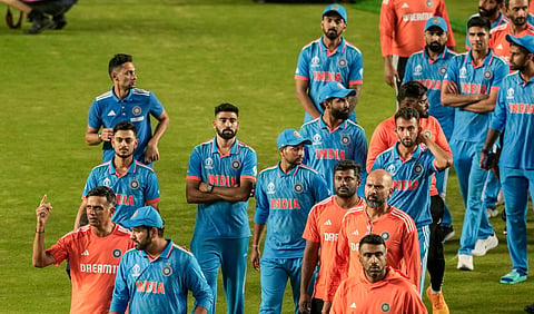 India's head coach Rahul Dravid, skipper Rohit Sharma and other players after the ICC Men's Cricket World Cup 2023 finals on Sunday, 19th November 2023. (Photo | PTI)