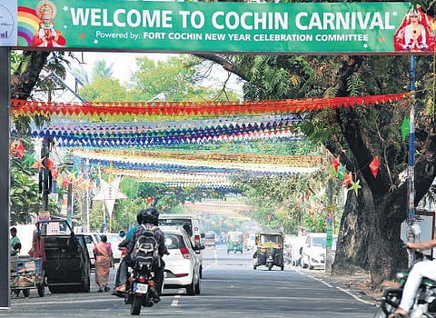 Representational image: The banner put up by the Cochin Carnival Committee. (Below) The rides at Veli Ground as part of the festivities