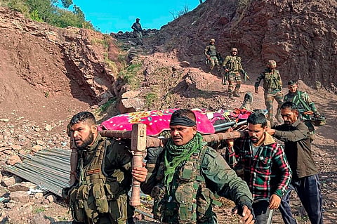 Army personnel and locals carry the body of an army officer near the site of an encounter with terrorists at Kalakote area, in Rajouri district on Wednesday, November 22, 2023. (Photo | PTI)