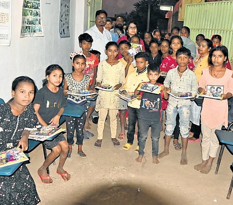 More than two dozen children get free education in Divya’s makeshift school .