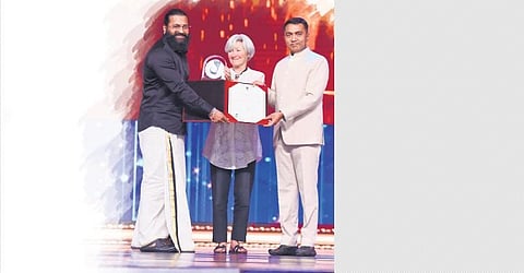 Rishab Shetty receiving the award at IFFI, Goa