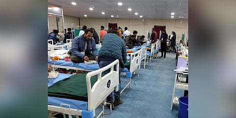 Rescued workers admitted at a community health centre at Chinyalisaur after their successful evacuation from the under-construction Silkyara Bend-Barkot Tunnel, in Uttarkashi district (Photo | PTI)