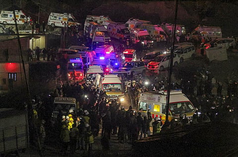 Ambulances with rescued workers come out from the collapsed Silkyara Tunnel, in Uttarkashi district. (Photo | PTI)