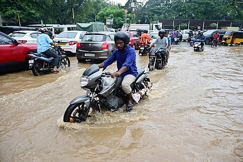 Vehicles on the flooded Five Furlong Road at Guindy, Chennai on Friday. (Photo | Ashwin Prasath)