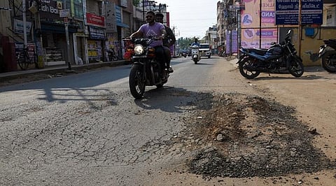 Depressions forming on the recently blacktopped Vayalur Road. (Photo | Express)