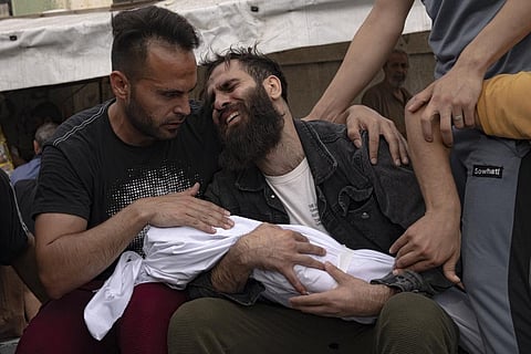 Palestinians mourn their relatives killed in the Israeli bombardment of the Gaza Strip, in a morgue in Khan Younis, Sunday, Oct. 29, 2023. (File Photo | AP)