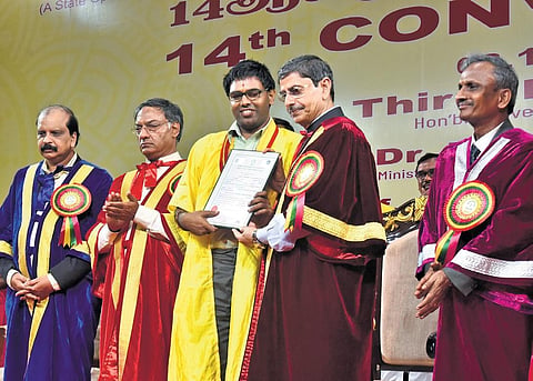 Governor RN Ravi hands over certificate to a visually-challenged student during the 14th convocation of Tamil Nadu Open University on Wednesday | P Jawahar