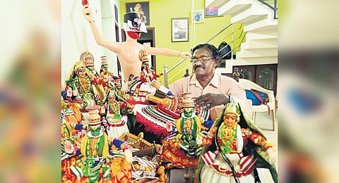 Karikkakom Thrivikraman with his wooden Kathakali figurines