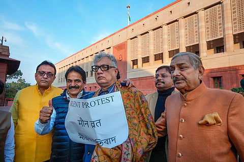 Suspended TMC MP Derek O' Brien and others during his silent protest outside the Parliament House during the Winter session, in New Delhi, Thursday, Dec. 14, 2023. (Photo | PTI)