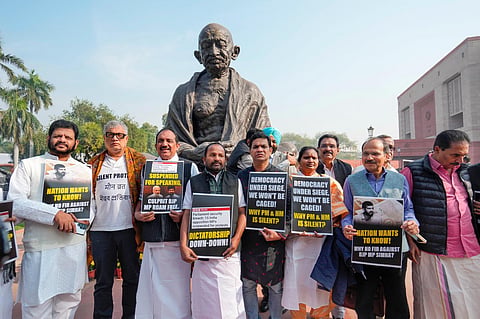Congress MP Adhir Ranjan Chowdhury with suspended MPs V.K. Sreekandan, Derek O'Brien and others at a protest during the Winter session of Parliament | PTI