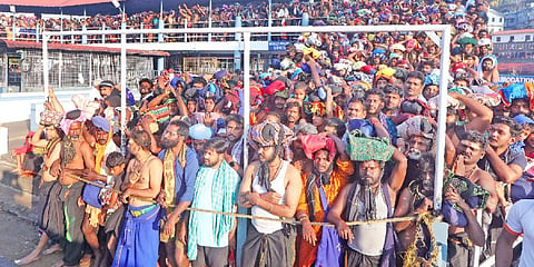 Pilgrims waiting for darshan near Sreekovil at Sannidhanam in Sabarimala Lord Ayyappa temple on Thursday.