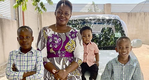 This family photo shows Pascazia Mazeze, executive director of the Tanzania Sickle Cell Warriors Organization, with her sons, from left, Ian, Rian and Gian outside their home in Tanzania. (Photo | AP)