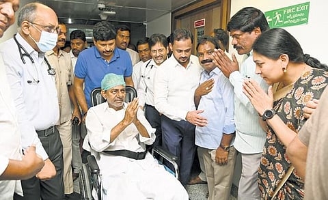 BRS president and former chief minister K Chandrasekhar Rao greets people as he leaves Yashoda Hospital on Friday
