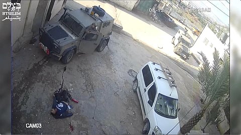 This image taken from video on Dec 8, 2023 in the Faraa refugee camp shows soldiers shooting down the men at close range..(Photo | AP)