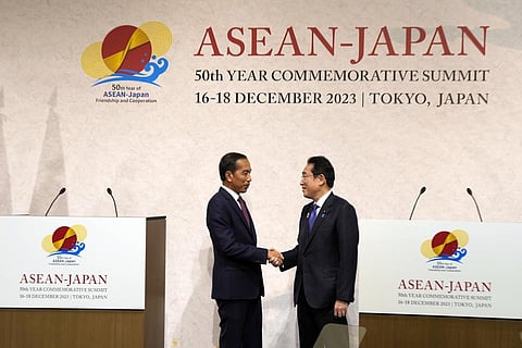 Indonesian President Joko Widodo (L) and Japan's Prime Minister Fumio Kishida shake hands following the ASEAN-Japan Commemorative Summit in Tokyo, Dec. 17, 2023. (AP Photo)