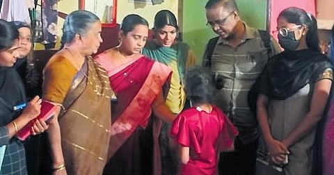 Child Welfare department officials interacting with the nine-year-girl at her house in Kurnool city on Monday.(Photo | Express)