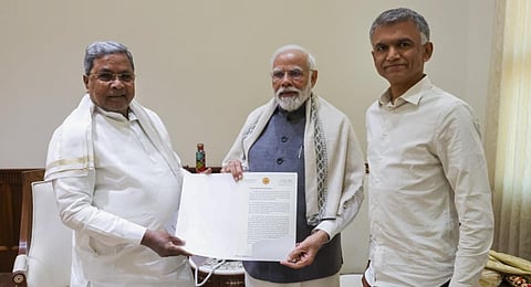 Prime Minister Narendra Modi with Karnataka Chief Minister Siddaramaiah during a meeting, in New Delhi. (Photo | PTI)