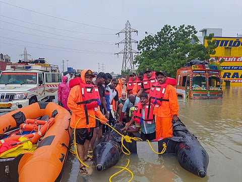 Indian Coast Guard men at rescue work in flood-hit Tuticorin district of Tamil Nadu. (Photo | PTI)