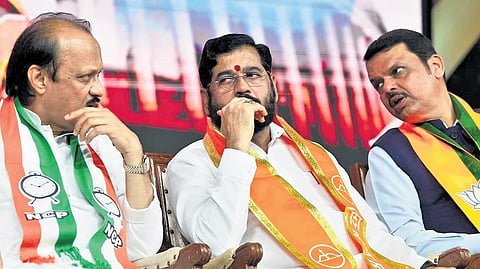 Maharashtra Chief Minister Eknath Shinde (C) with Deputy Chief Ministers Devendra Fadnavis of the BJP (R) and Ajit Pawar of the NCP (L).