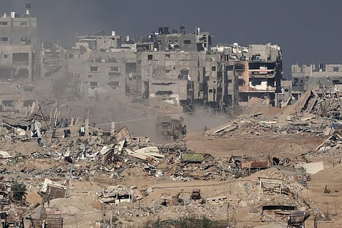 The image taken from Southern Israel shows a military vehicle driving inside Gaza on December 29, 2023