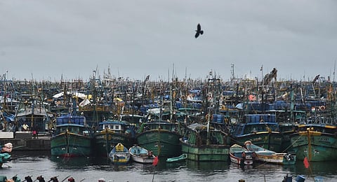 IMD advised the fishermen not to venture into sea for fishing at Kasimedu on Saturday while Cyclone Michaung expected to hit Chennai coast - Express / P Jawahar