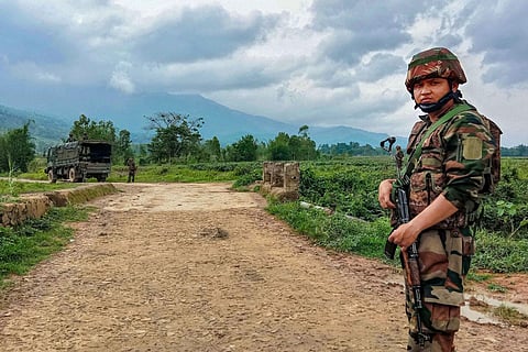 Security personnel patrol a violence-hit area in Manipur