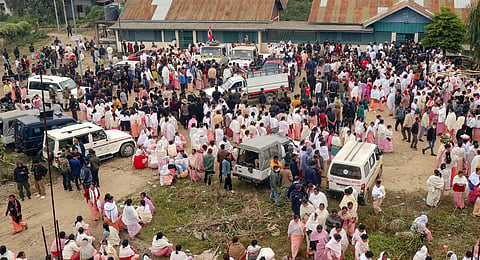 Family members and relatives arrive to claim the bodies of the 13 people who were killed after a gunfight in a border village of Manipur's Tengnoupal district.(Photo | PTI)