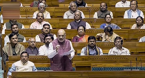 Union Home Minister Amit Shah speaks in the Lok Sabha during the Winter session of Parliament, in New Delhi, Wednesday, Dec. 6, 2023. (PTI Photo)