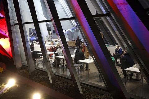 People are seen inside the Broad Art Museum near Berkey Hall on the campus of Michigan State University as they shelter in place, late Monday, Feb. 13, 2023. (Photo | AP)