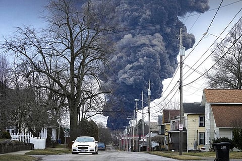 A black plume rises over East Palestine, Ohio, as a result of a controlled detonation of a portion of the derailed Norfolk Southern trains Monday, Feb. 6, 2023. (Photo | AP)