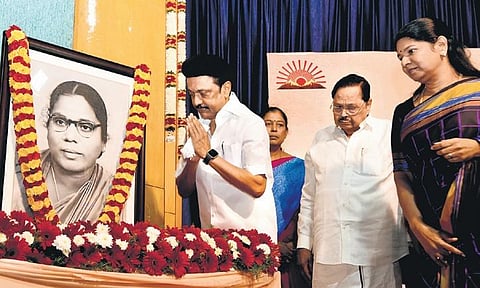 Chief Minister MK Stalin offering floral tributes to portrait of Sathyavani Muthu on Sunday, as MP Kanimozhi Karunanidhi looks on | Express