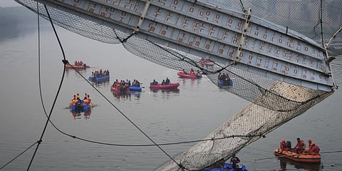The suspension bridge on the Machchhu river in Morbi town collapsed on October 30 last year. (Photo | AP)
