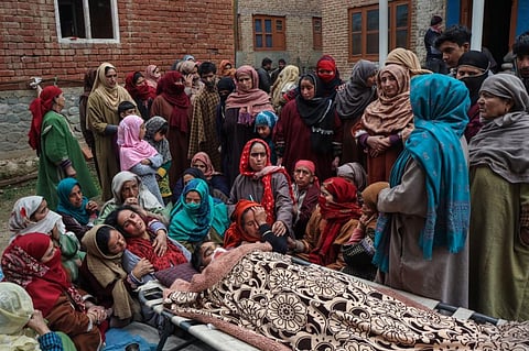 Family members mourn after Sanjay Sharma, a Kashmiri Pandit, was shot dead by terrorists in the Achan area of Pulwama district, Sunday, Feb. 26, 2023. (Photo | PTI)