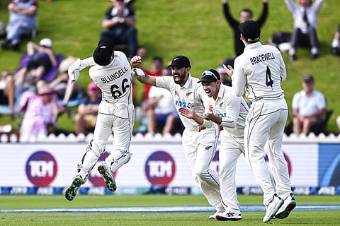 New Zealand's Tom Blundell (L) celebrates with teammates after catching out England's Ben Duckett on day 5 of their cricket test match in Wellington, Feb 28, 2023. (Photo | AP)