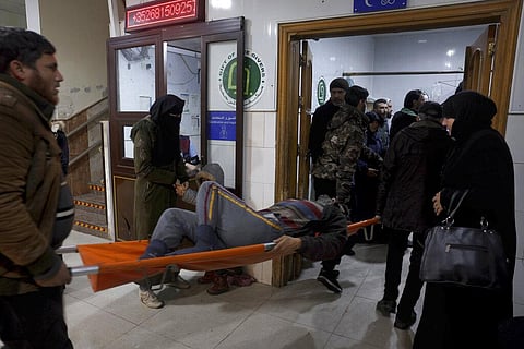 People carry a man injured in an earthquake into the hospital in the town of Darkush, Idlib province, northern Syria, Monday, Feb. 6, 2023. (Photo | AP)