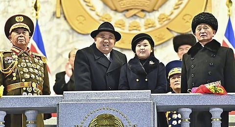North Korean leader Kim Jong Un, center left, with his daughter attends a military parade to mark the 75th founding anniversary of the Korean People’s Army. (Photo | AP)