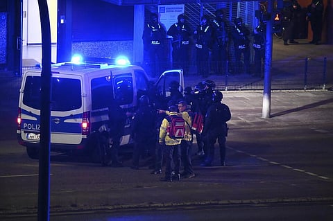 Armed police officers near the scene of a shooting in Hamburg, Germany on Thursday March 9, 2023 after one or more people opened fire in a church. (Photo | AP)